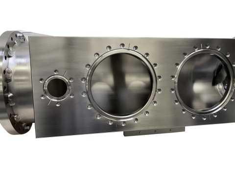 Precision-machined aluminum component with multiple circular cutouts and flange