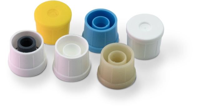 Six Thermoplastic injection molded test tube tops, in various colors