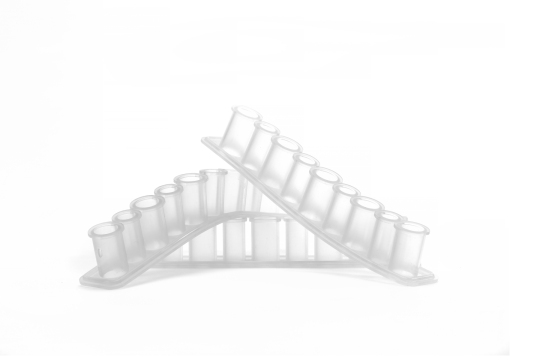 Clear liquid silicone rubber (LSR) molded test tube rack with a curved design, featuring multiple slots.