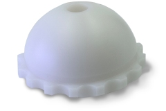 Machined White Acetabular cup (socket) for orthopedic implants, showcasing outer surface