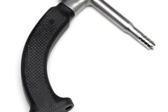 Orthopedic drill guide with machined metal shaft and plastic handle, used for precise surgical procedures