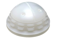 Machined White Acetabular cup (socket) for orthopedic implants, showcasing outer surface